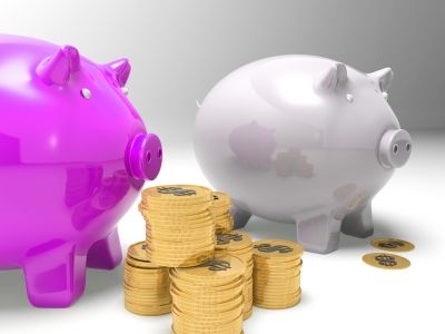 Piggybanks And Coins Showing American Earnings of Stuart Miles at FreeDigitalPhotos.net